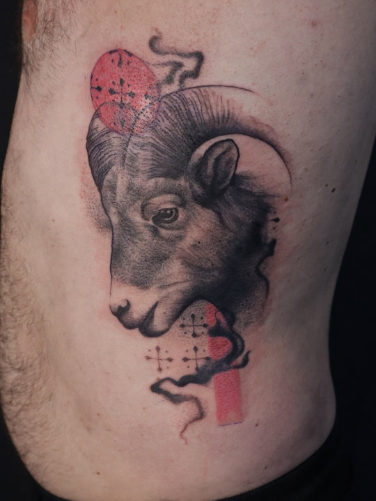 ram tattoo on the ribs