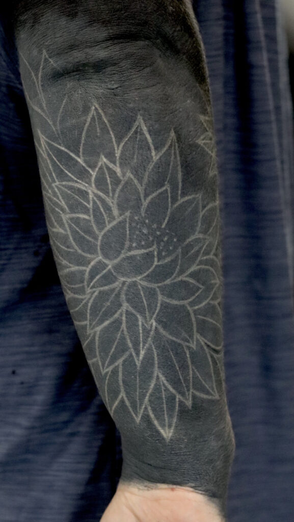 healed white over black tattoo by matt hunt in birmingham Uk
